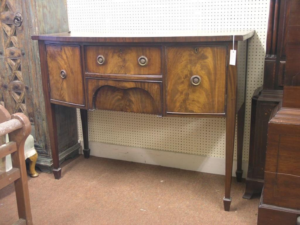 Appraisal: An early th century mahogany sideboard bow-fronted with two central