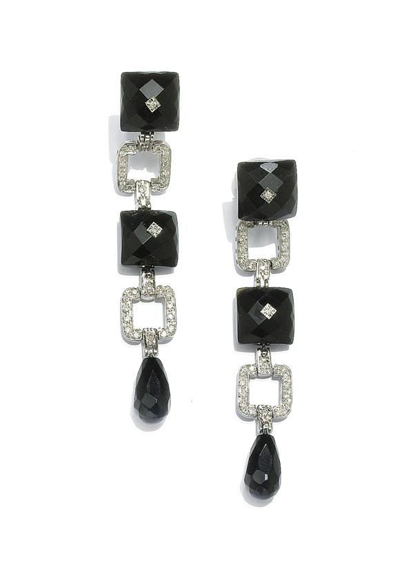 Appraisal: ONYX AND DIAMOND EAR PENDANTS White gold Fancy ear studs