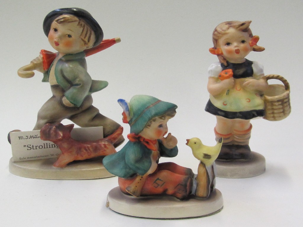 Appraisal: Three Hummel figures 'Strolling Along' TMK 'Singing Lesson' TMK and