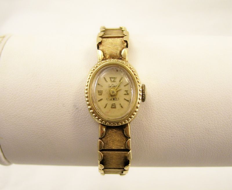 Appraisal: kt Le Courier Ladies Wristwatch jewels Band and back of