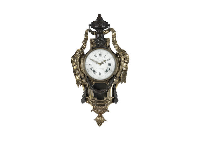 Appraisal: An French patinated and gilt bronze cartel clock the dial