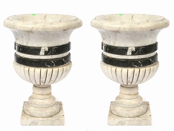 Appraisal: A pair of campana form marble urns height in width