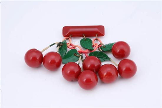 Appraisal: BAKELITE DANGLING CHERRIES PIN Eight carved varigated red cherries with