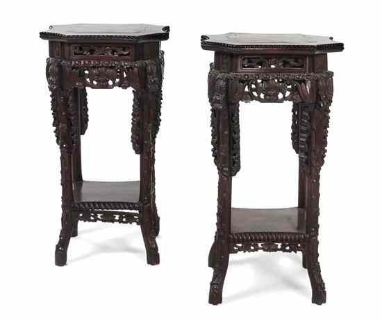 Appraisal: A Pair of Chinese Carved Hardwood Stands having a marble