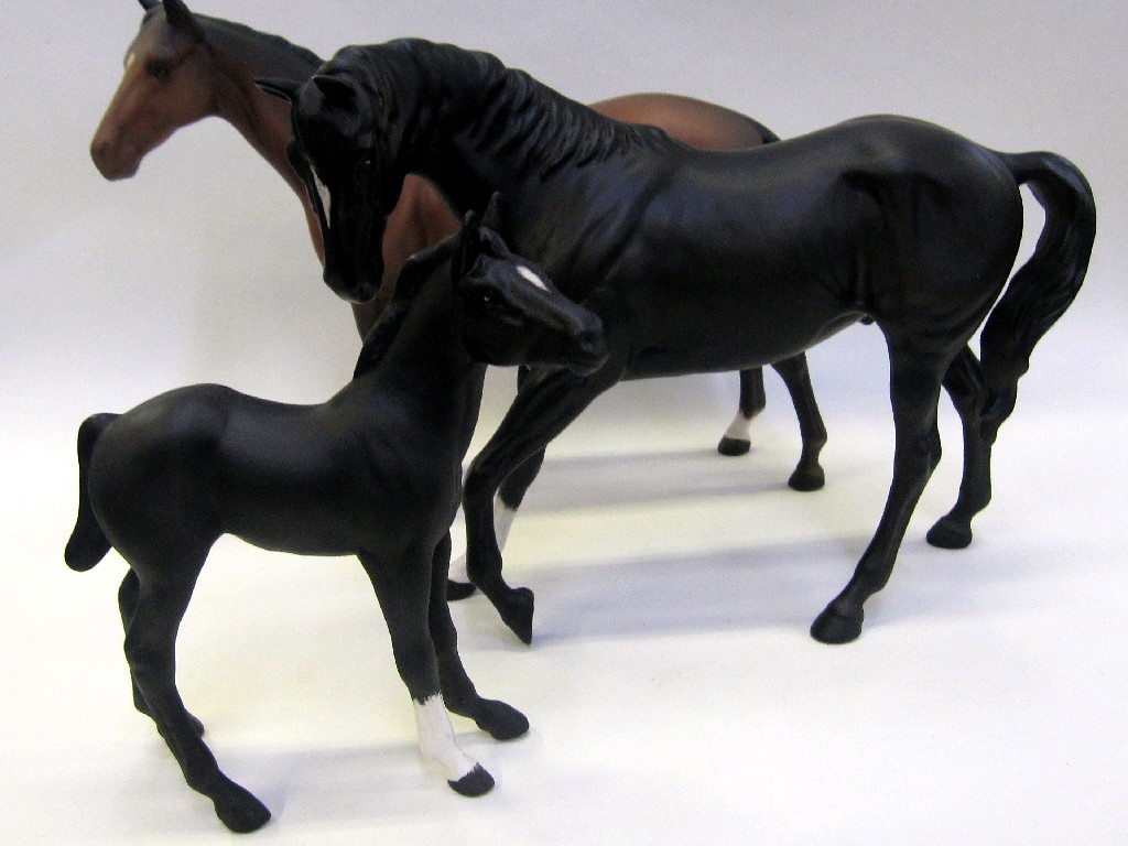 Appraisal: Beswick Black Beauty and foal and a matt brown horse