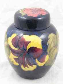 Appraisal: A Moorcroft ginger jar with lid hibiscus on blue ground