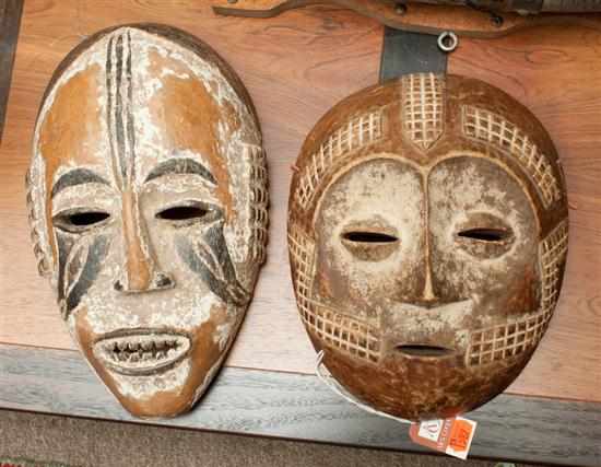 Appraisal: Two African carved wooden masks one Igbo the other Lega