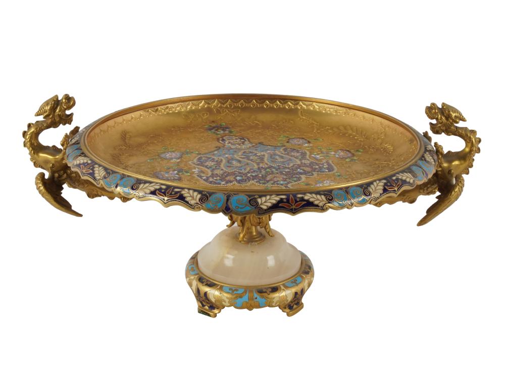 Appraisal: GILT METAL-MOUNTED CHAMPLEVE ENAMEL TAZZAthe shallow round bowl flanked by