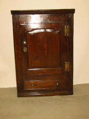 Appraisal: AN OAK WALL CUPBOARD with moulded cornice single panelled door