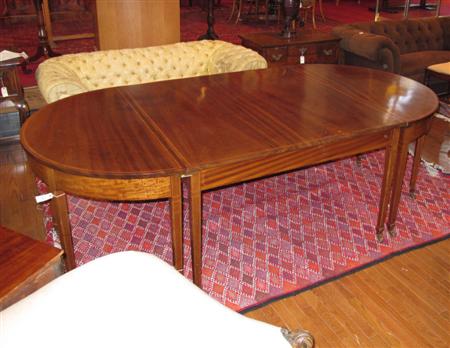 Appraisal: An Edwardian mahogany inlaid D-end table the cross banded top