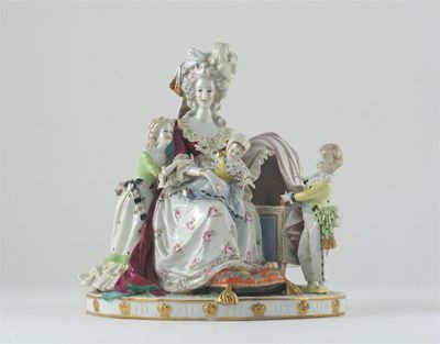 Appraisal: A Continental porcelain figure of Marie Antoinette seated beside a