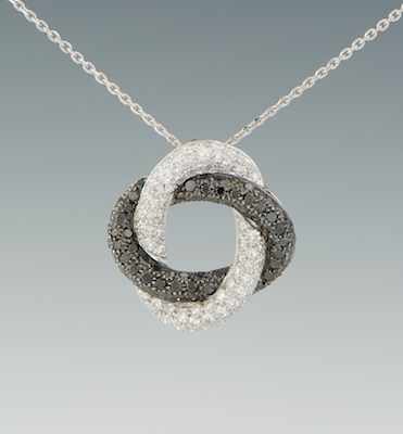 Appraisal: A Black and White Diamond Pendant k white gold pendant