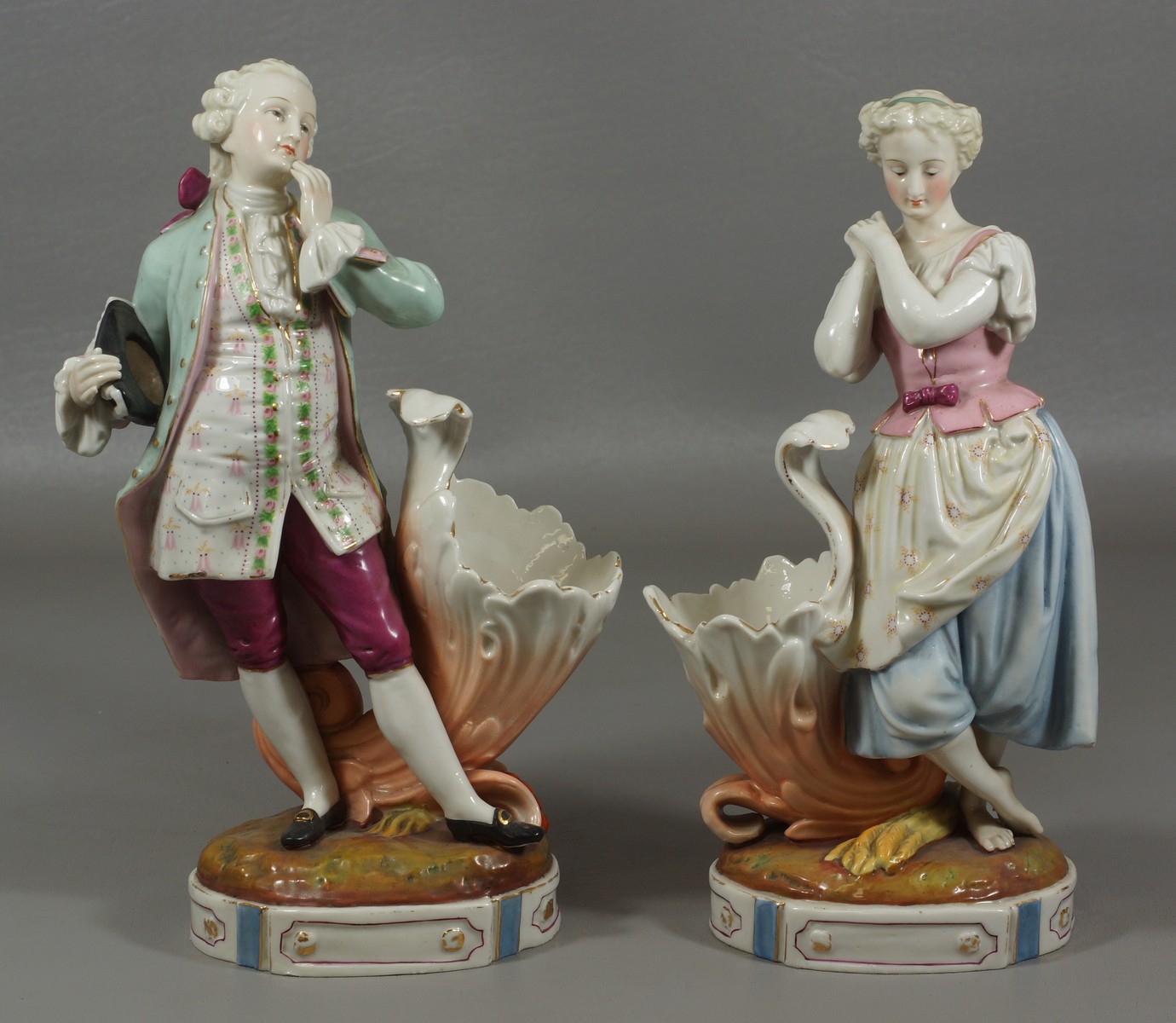 Appraisal: Continental porcelain figurines of young maiden gentleman h