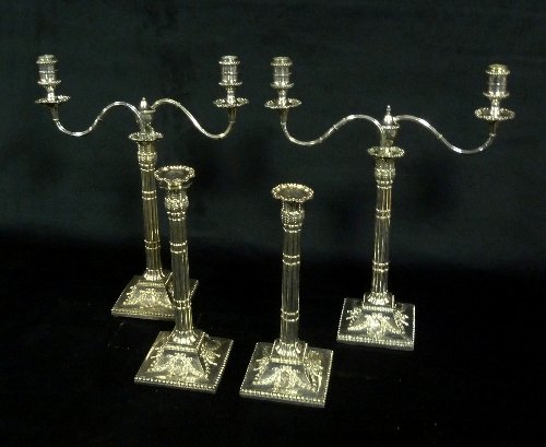 Appraisal: A set of four Sheffield plated candlesticks of compound column