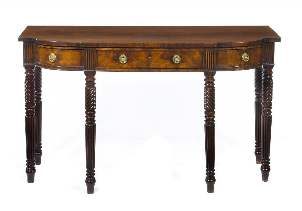 Appraisal: A GEORGE IV MAHOGANY SERVING TABLE of breakfront form fitted