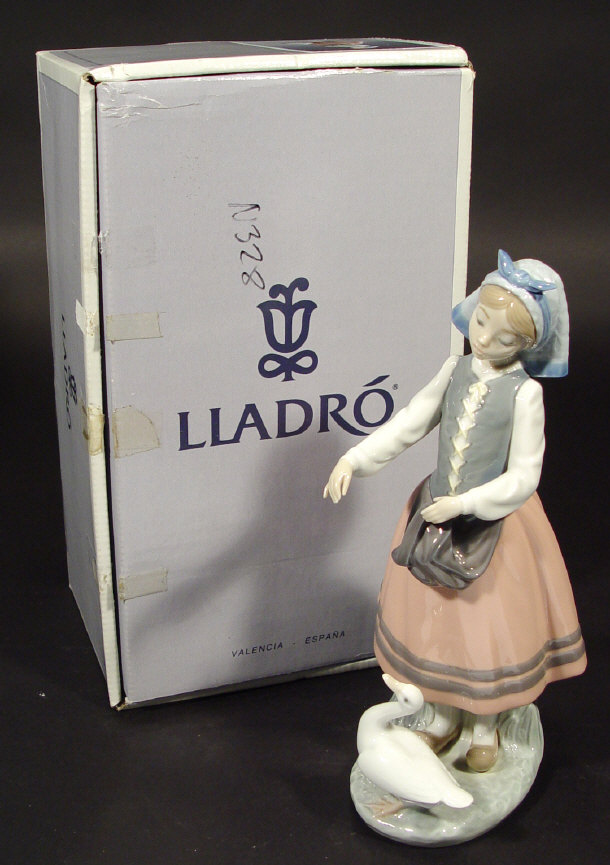 Appraisal: Boxed Lladro porcelain figurine Josepha feeding a duck with hand