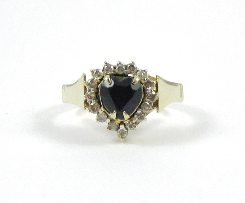 Appraisal: SAPPHIRE DIAMOND AND FOURTEEN KARAT GOLD RING with round-cut diamonds