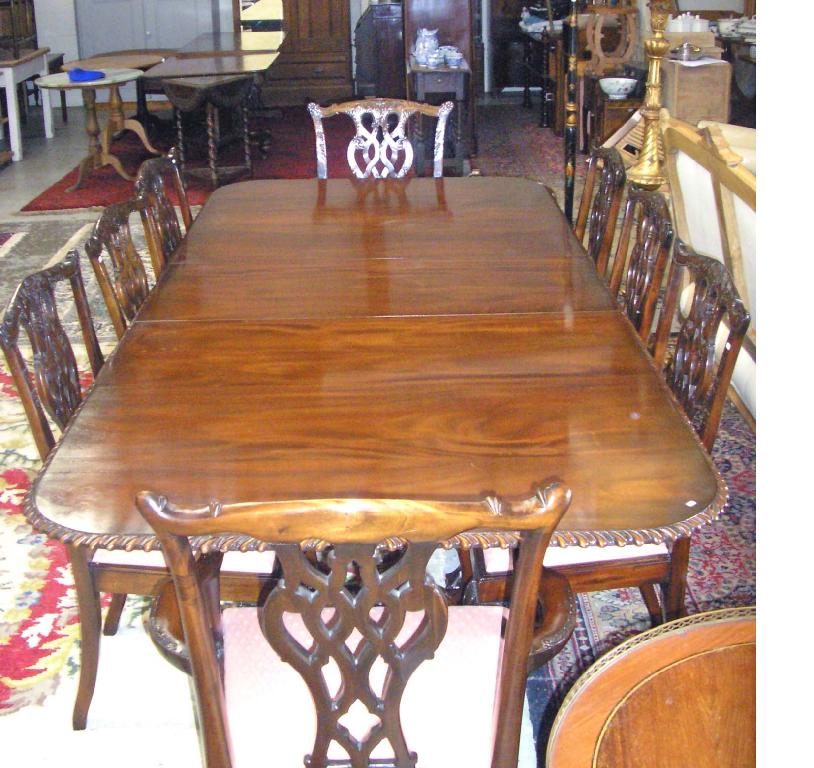 Appraisal: A reproduction mahogany Chippendale design twin pedestal dining table -