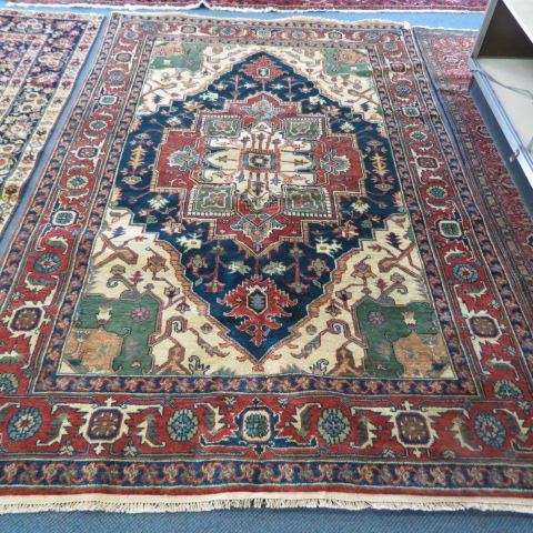 Appraisal: Heriz Persian Handmade Rug grand central medallion stylized floral border