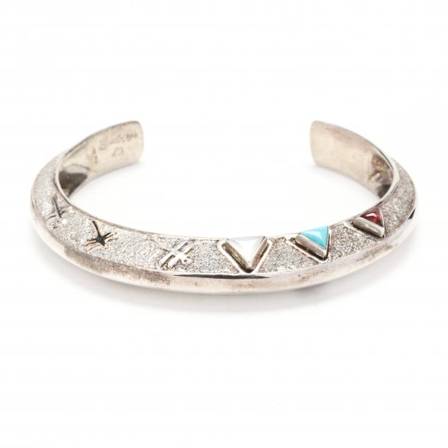 Appraisal: STERLING SILVER GOLD AND GEM-SET CUFF BRACELET The tapered silver