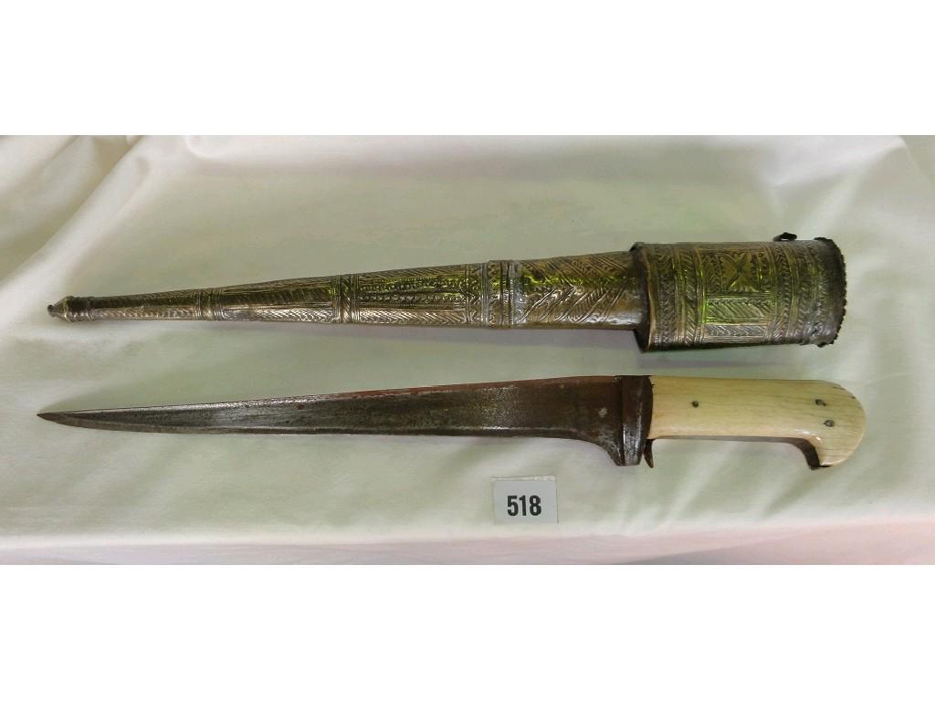 Appraisal: A Kyber knife with bone handle and brass patterned detail