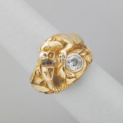 Appraisal: GUSTAV MANZ GOLD AND DIAMOND FIGURAL RING Cast and chased