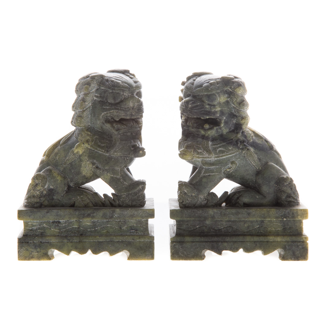 Appraisal: Pair Chinese carved jade foo dogs each on altar-form base