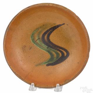 Appraisal: Pennsylvania redware pie plate th c with green and brown