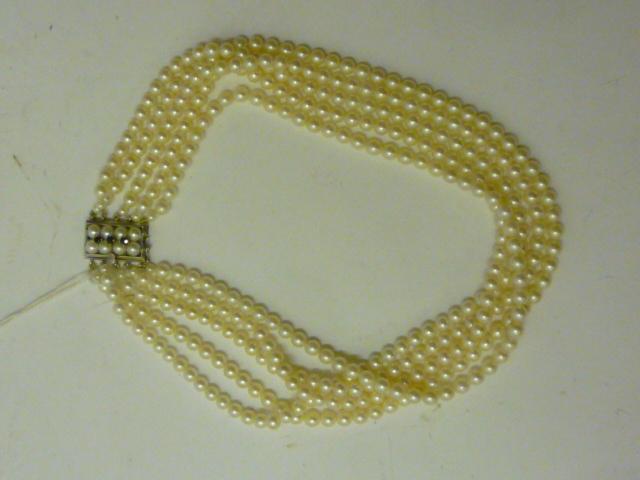 Appraisal: A CULTURED PEARL CHOKER having five strands of uniform pearls