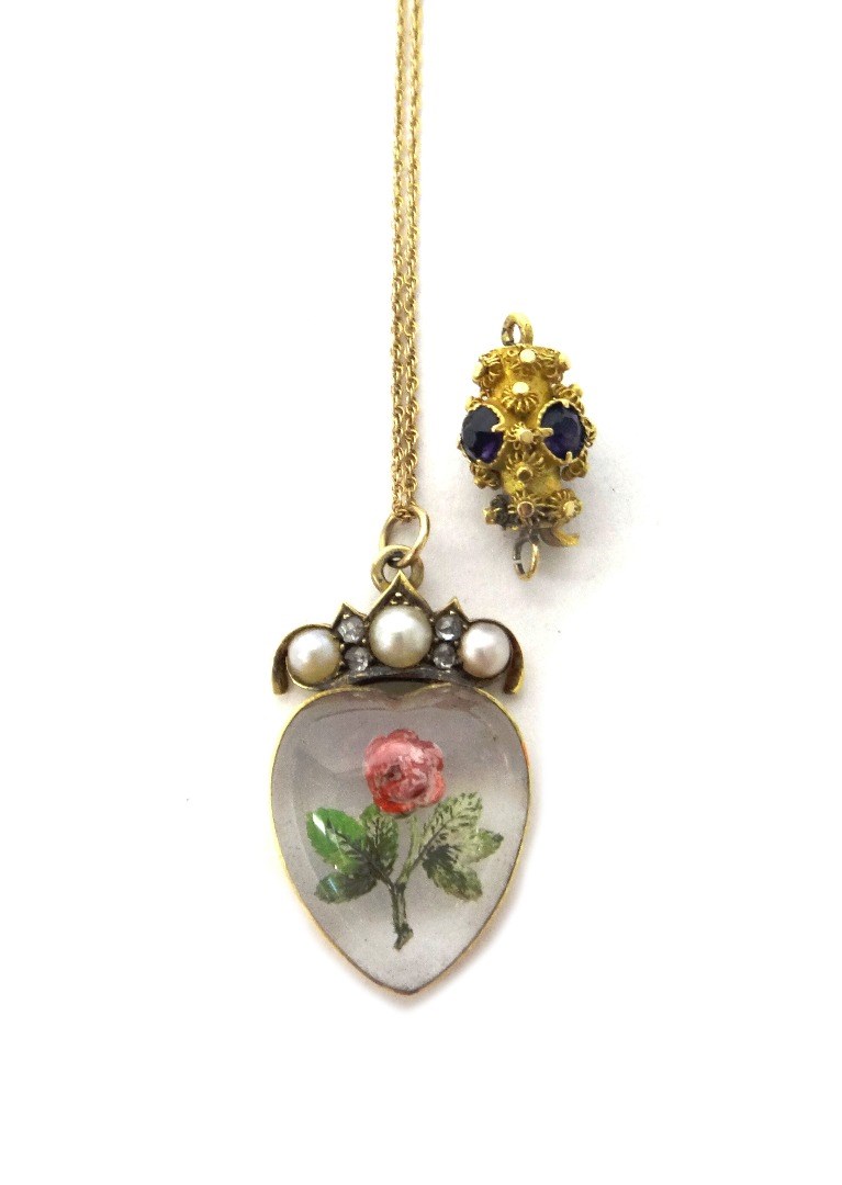 Appraisal: A Victorian gold mounted reverse painted heart shaped intaglio crystal