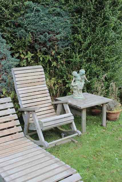 Appraisal: A PAIR OF ROCKING GARDEN ARMCHAIRS wide together with two