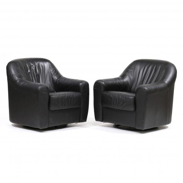 Appraisal: ATTRIBUTED NATUZZI PAIR OF LEATHER CLUB CHAIRS Italy black leather