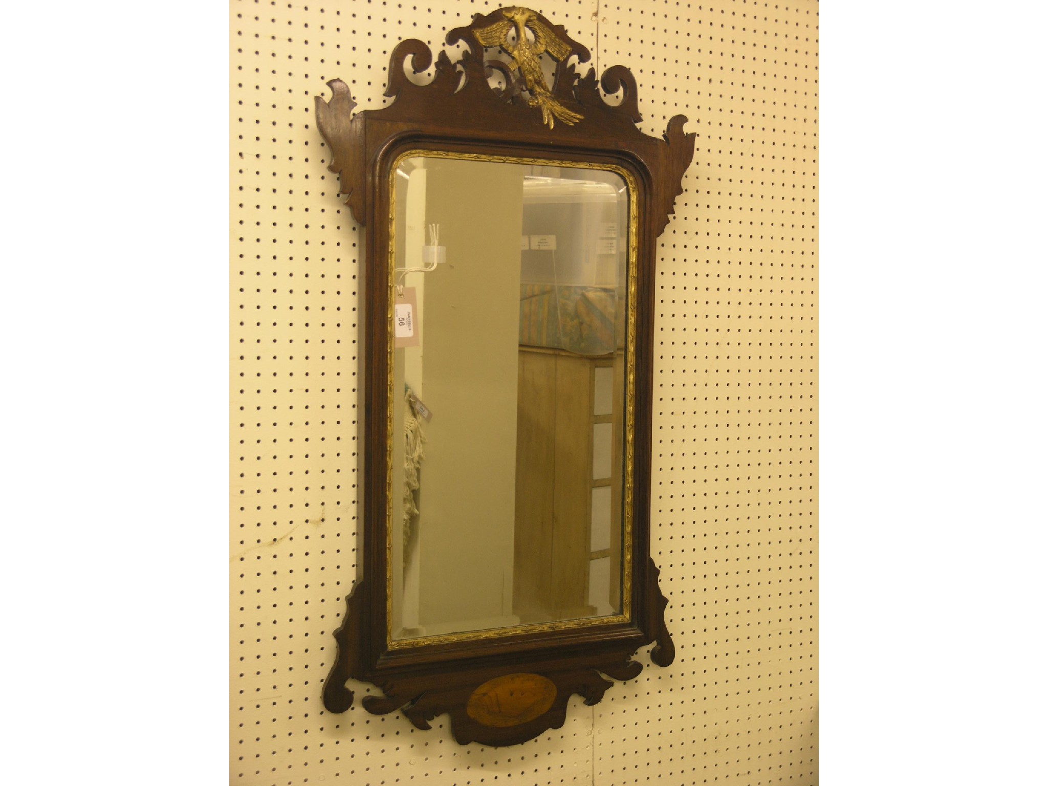 Appraisal: A Chippendale-style mahogany wall mirror pierced cresting carved with gilded