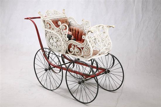 Appraisal: WICKER BABY BUGGY White with scroll decoation a red frame