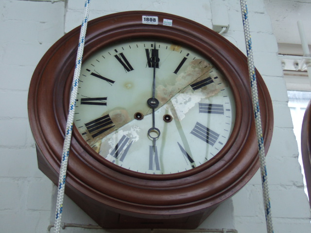 Appraisal: A walnut cased circular dial clock with two brass train