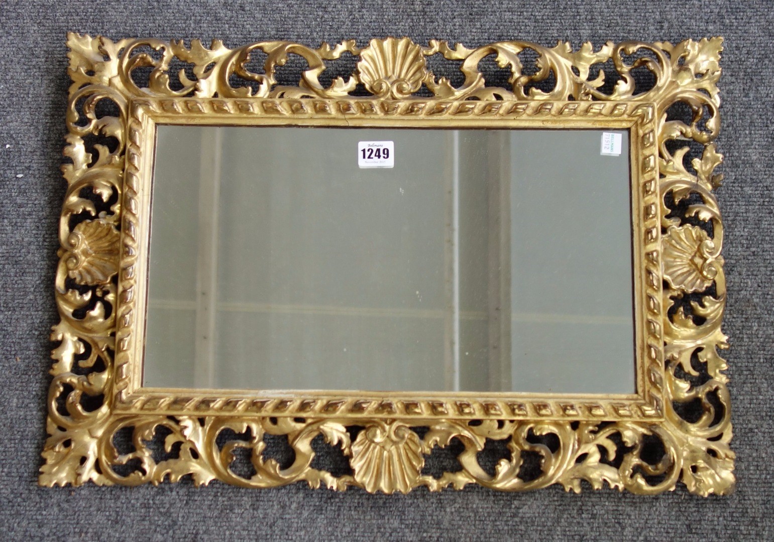 Appraisal: A small th century gilt framed rectangular wall mirror with