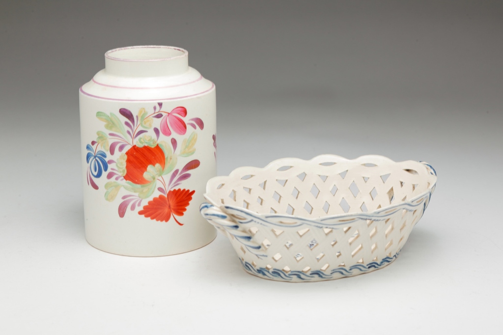 Appraisal: Circa A reticulated fruit basket with twisted handles and floral