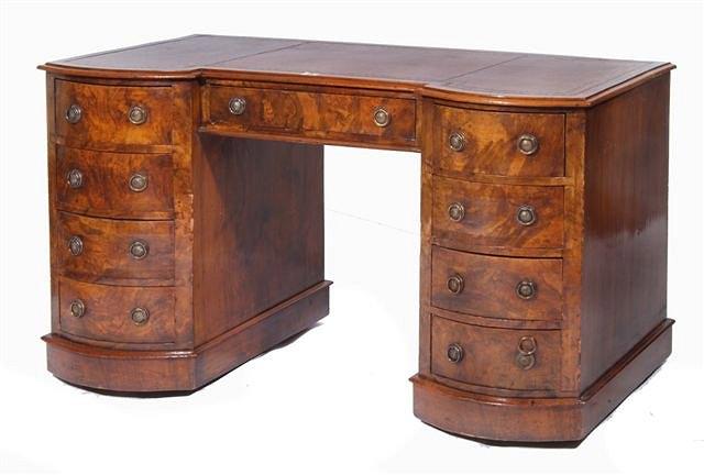 Appraisal: A VICTORIAN FIGURED WALNUT WRITING DESK fitted one long central