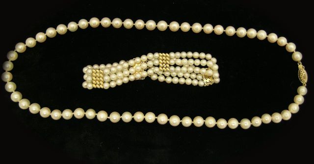 Appraisal: Triple strand pearl bracelet with mm pearls and K yellow