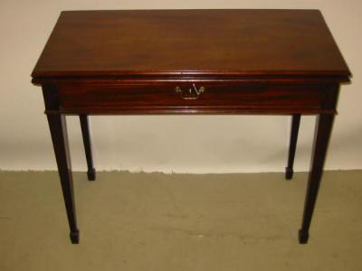 Appraisal: A GEORGE III MAHOGANY FOLDING TEA TABLE of oblong form