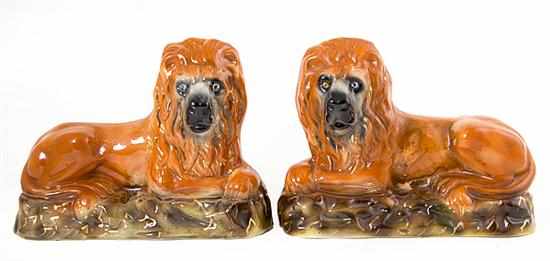 Appraisal: Pair unusual Staffordshire pottery lions late th century recumbent orange