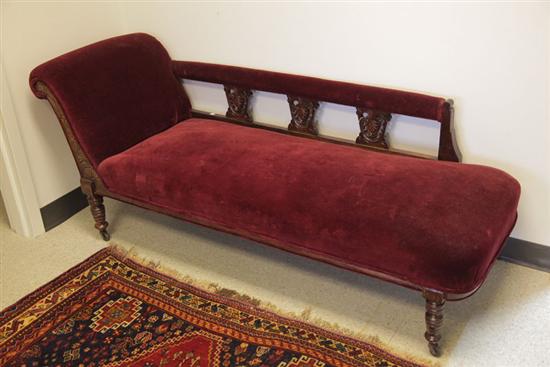 Appraisal: VICTORIAN FAINTING COUCH Walnut with carved and incised decoration turned