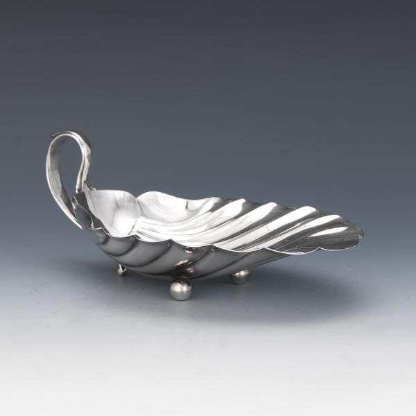 Appraisal: M FRED HIRSCH STERLING SILVER SHELL FOOTED SAUCE BOAT x