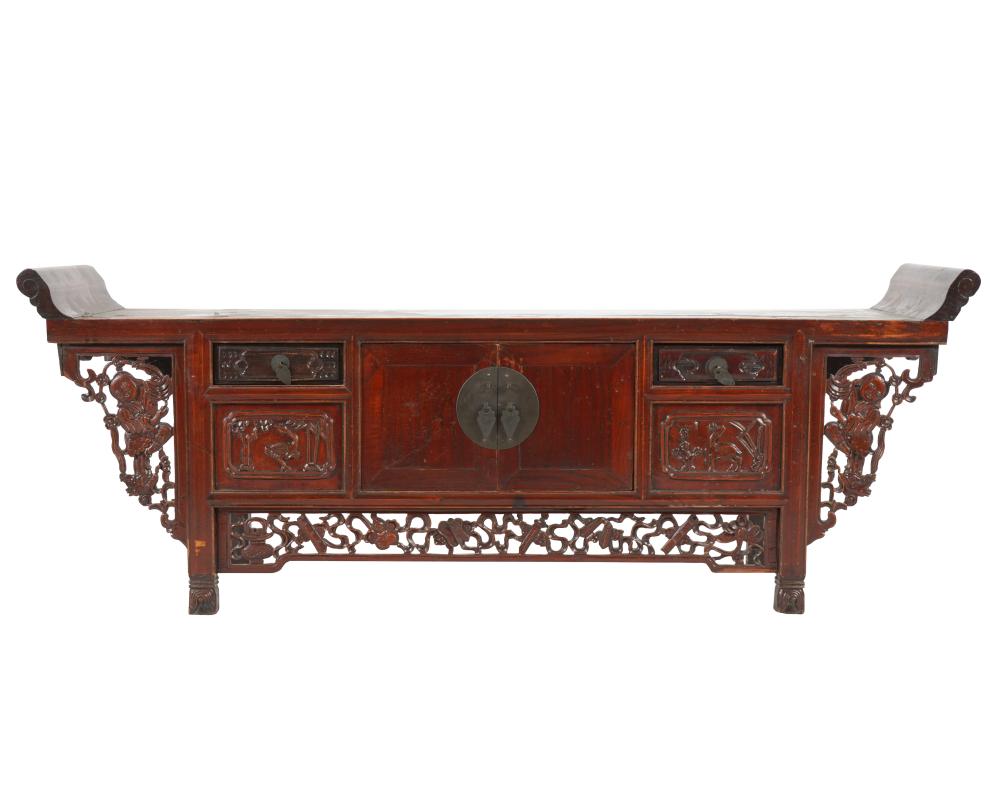 Appraisal: CHINESE CARVED HARDWOOD LOW CABINETwith a pair of hinged doors