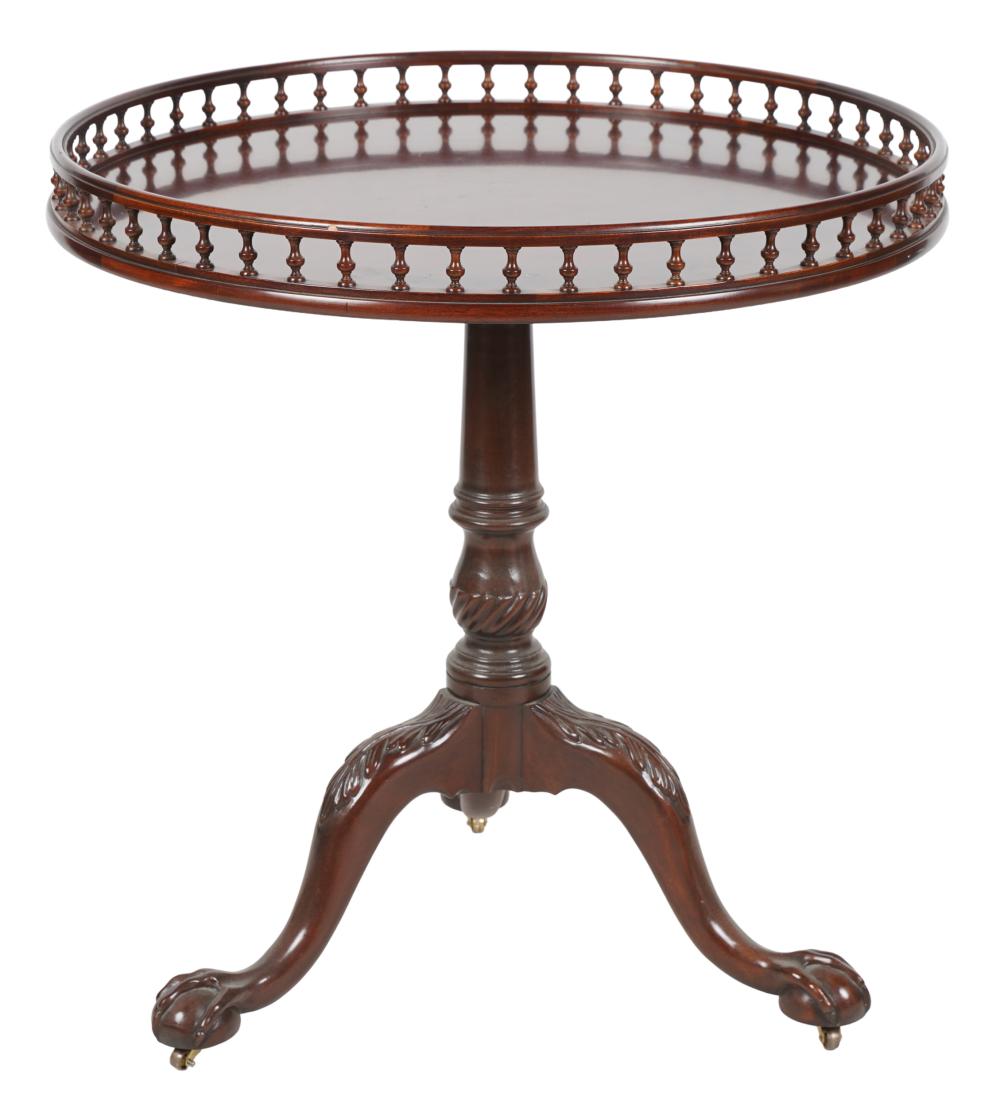 Appraisal: BAKER MAHOGANY GALLERY RIM TABLEwith tilt action and paper label