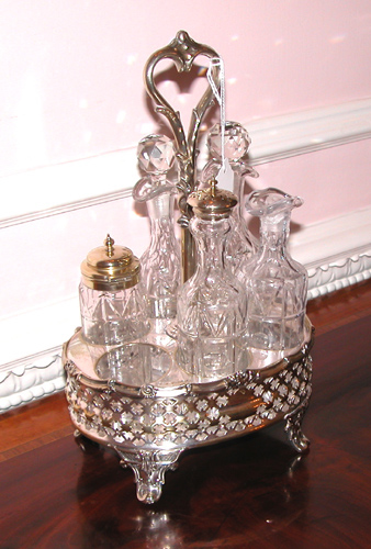 Appraisal: English Silver Plate and Cut Glass Caster Set having bottles