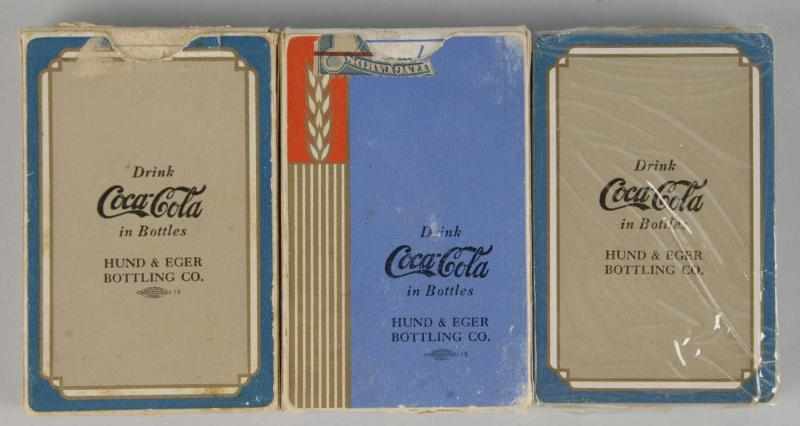 Appraisal: Lot of Coca-Cola Card Decks Description Includes two Hund Eger