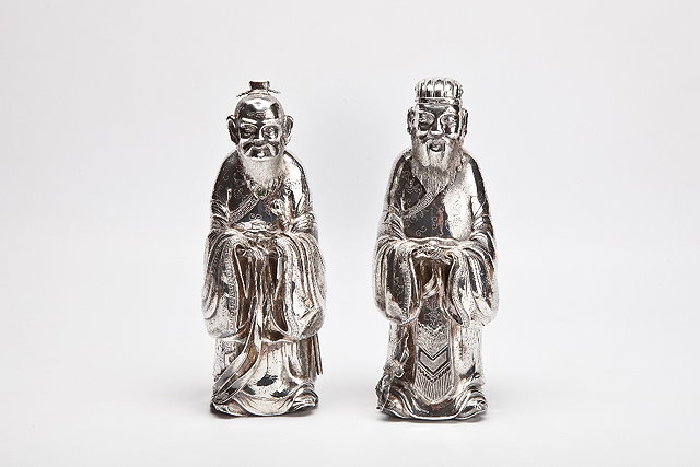 Appraisal: A PAIR OF CHINESE SILVER FIGURES OF A STANDING LAO