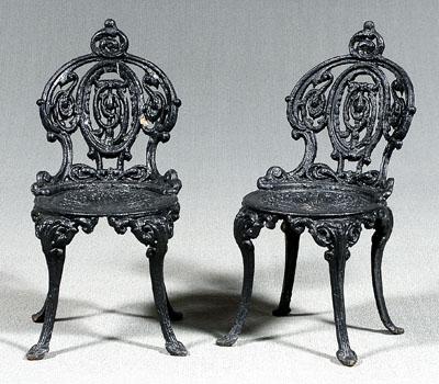 Appraisal: Pair cast iron garden chairs each with openwork back and