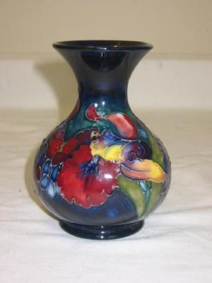 Appraisal: A WALTER MOORCROFT POTTERY VASE of bellied form with flared